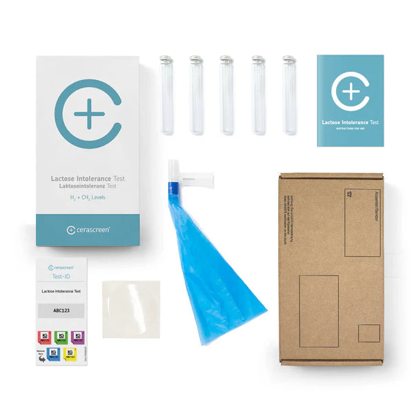 Inhalt des Laktoseintoleranz Testkits von cerascreen: Verpackung, Anleitung, Mundstück mit Luftbeutel, Probenröhrchen, Rücksendeumschlag
